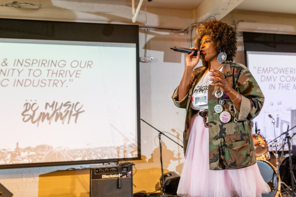 DC Music Summit with Dior Ashley Brown standing on stage