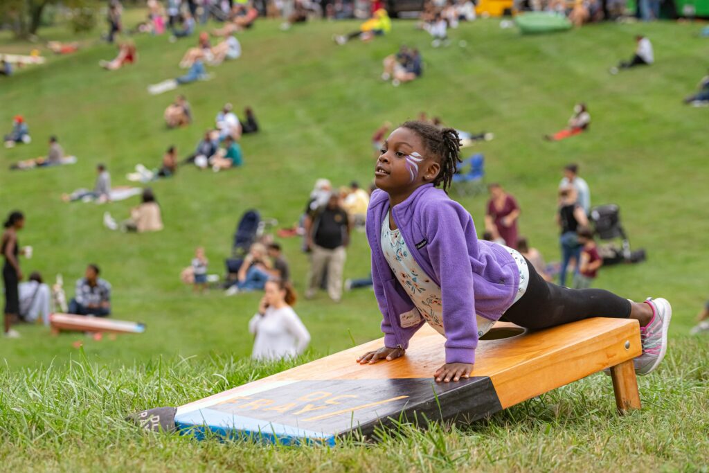 Kids playing on the lawn at the Parks at Walter Reed