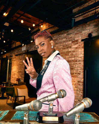 Nia Monaé Press Photo with her 3 Wammie Awards