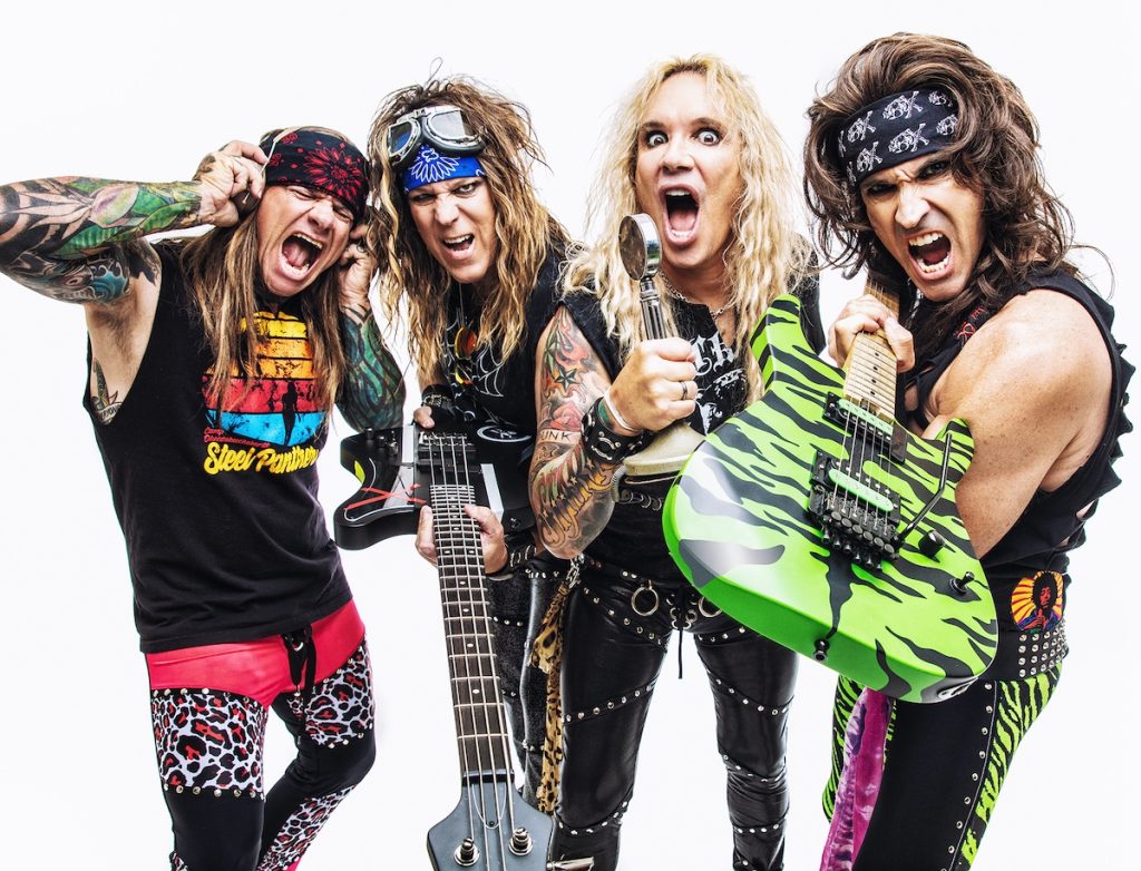 Steel Panther 80's hair metal rockers posing for the camera
