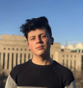Cameron Landry in front of a government building