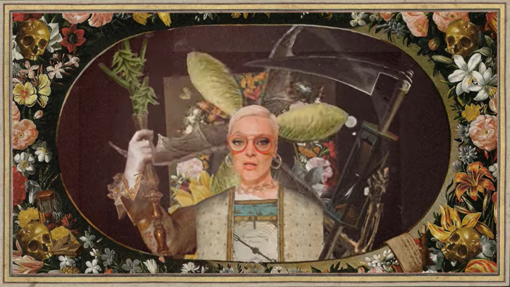 Hot Mustard - "The End of TIme" music video thumbnail. Framed by flowers, a woman is wearing glasses and rabbit ears.