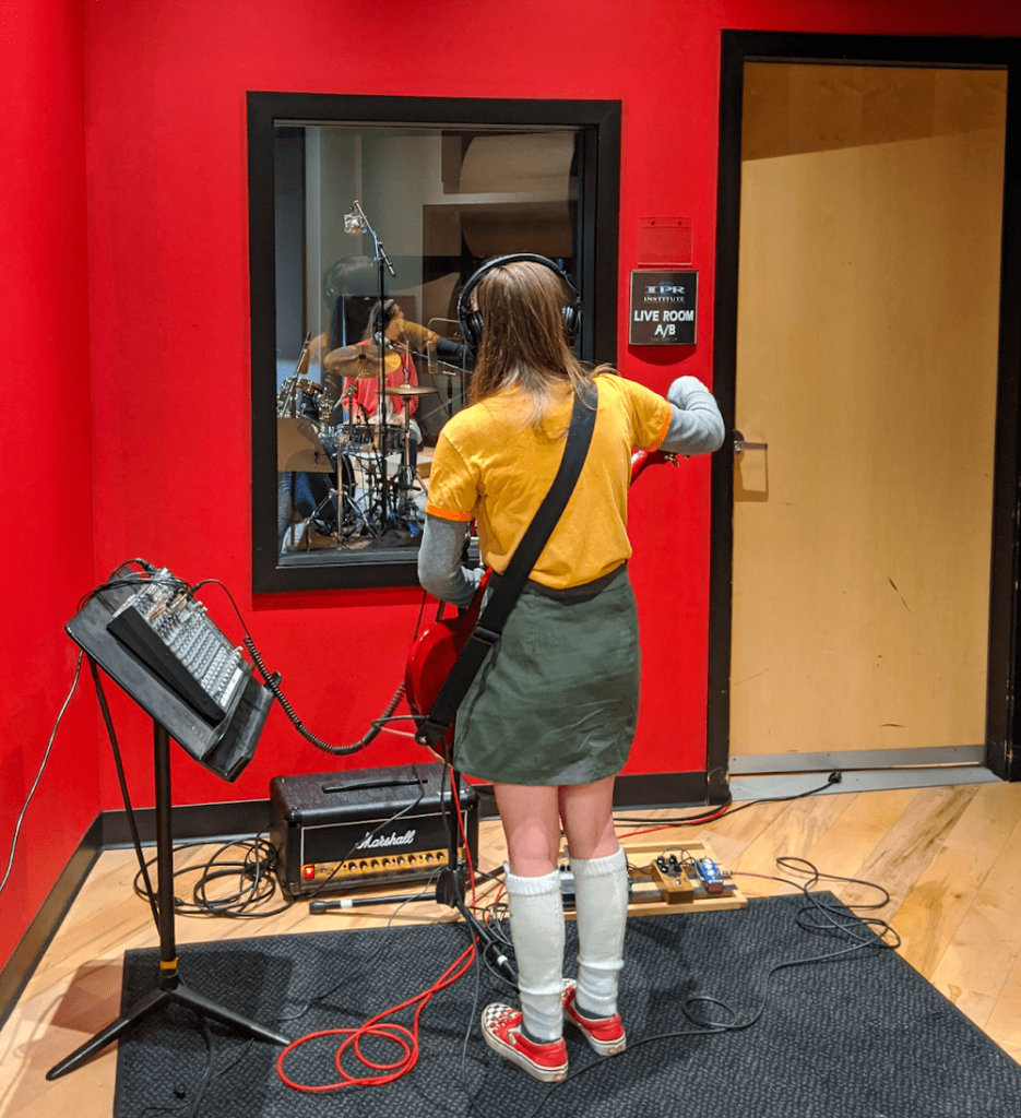 Annie recording guitar at IPR Studio