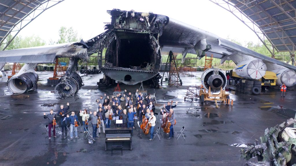 Five for Fighting performs in Ukraine in front of the wreckage of the Mriya