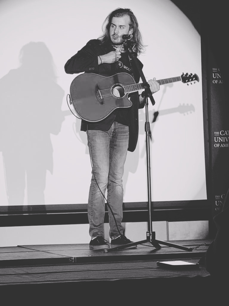 Young Wolf performs on stage