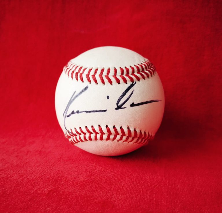 A baseball signed by Kevin Costne