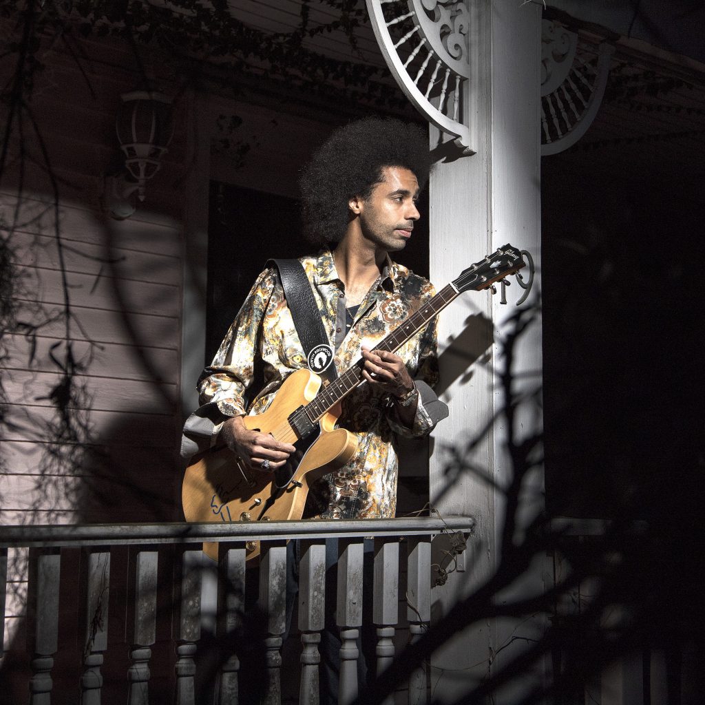 Selwyn Birchwood performs live on stage