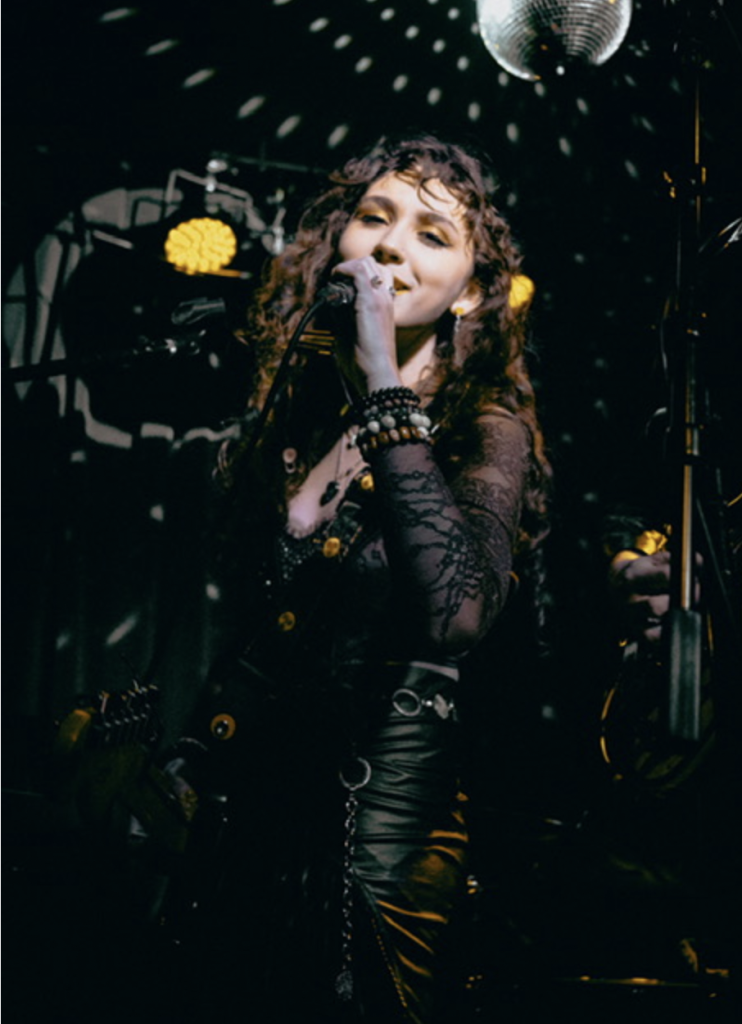 Calista Garcia performing on stage.