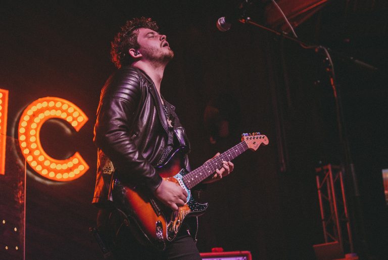Clay Melton performing live on guitar - Photo courtesy of Miguel Martinez