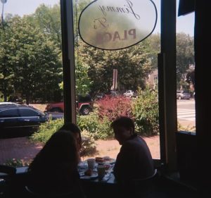 One Way Out band members sit inside Jimmy T's restaurant.
