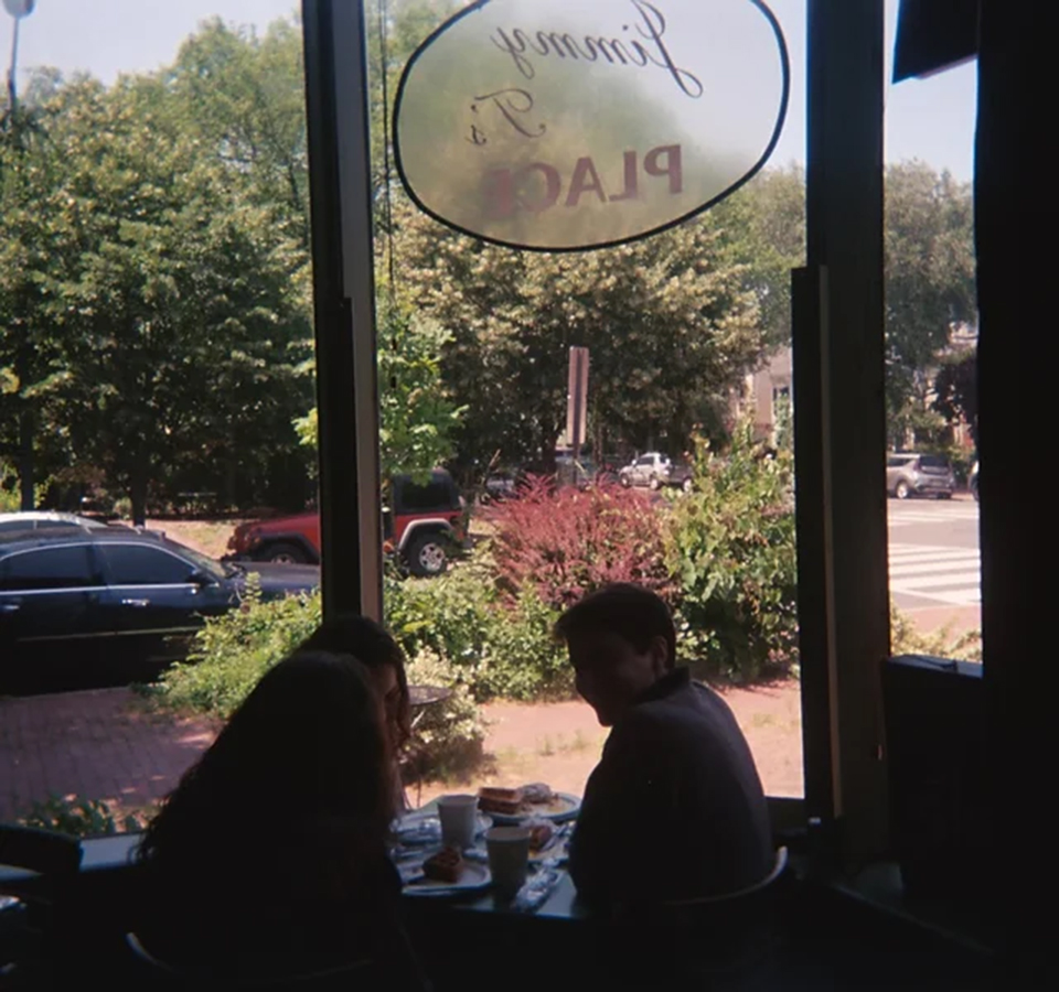 One Way Out band members sit inside Jimmy T's restaurant.