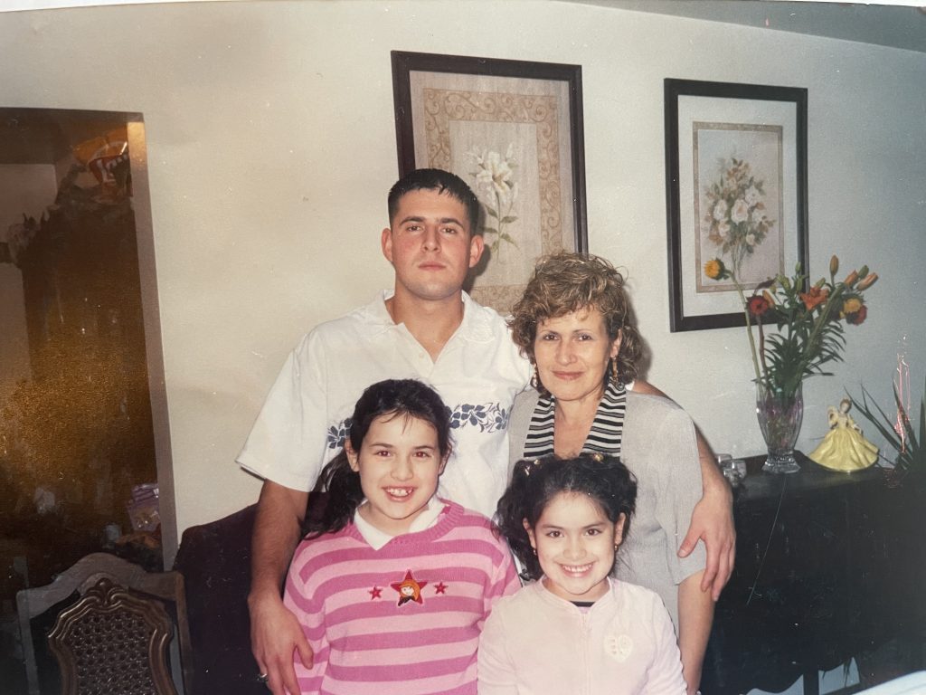 Family photo from 2004 of aSanTIS with her mother, Rosa, older brother, Francisco, and younger sister, Rebecca.
