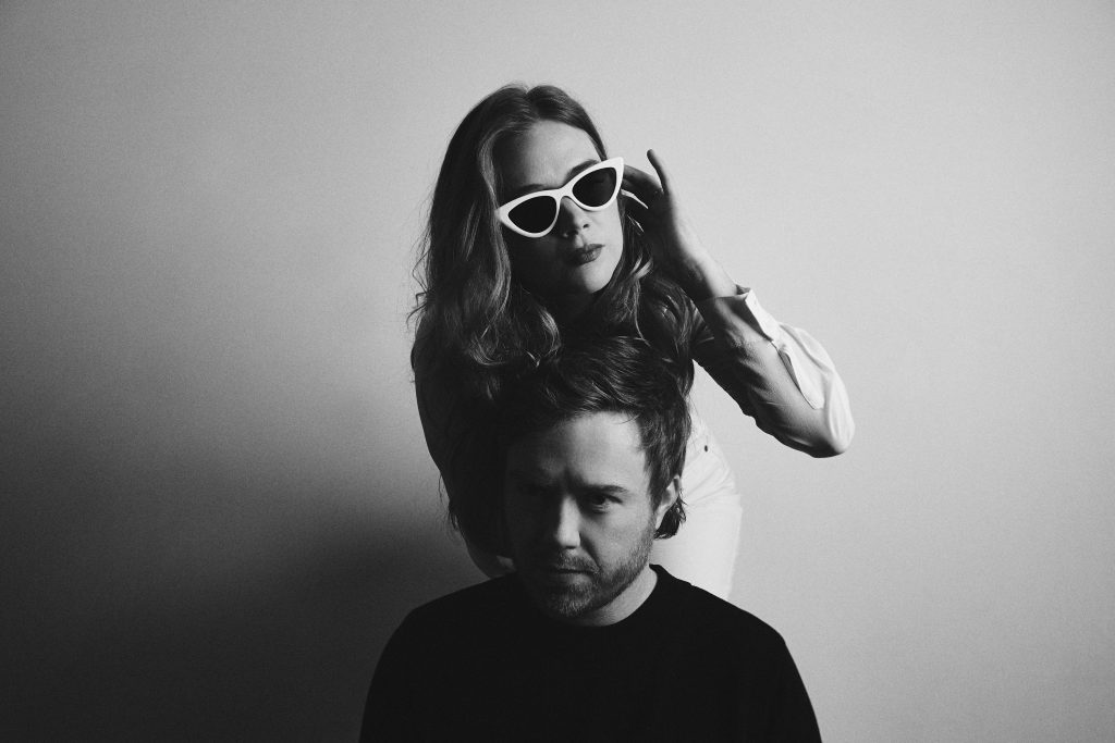 Fast Romantics duo pose for a black and white photograph.