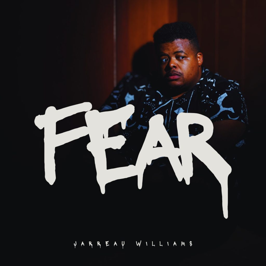 Jarreau Williams looking scared in a corner with big white dripping letters that spell out "FEAR."