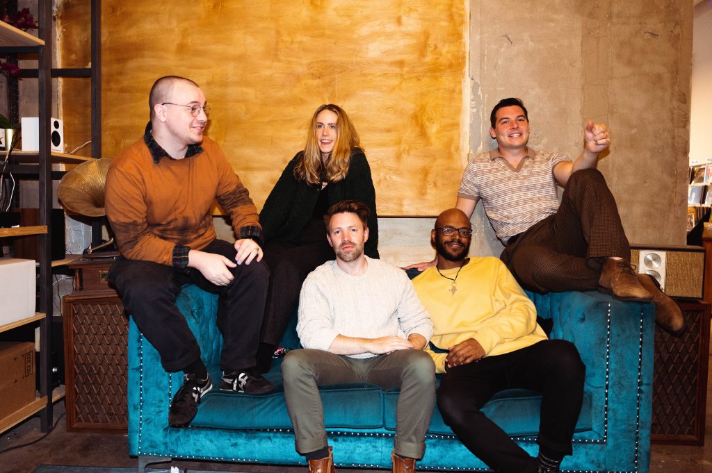 Broke Royals posing on a couch. Photo by Aaro Keipi
