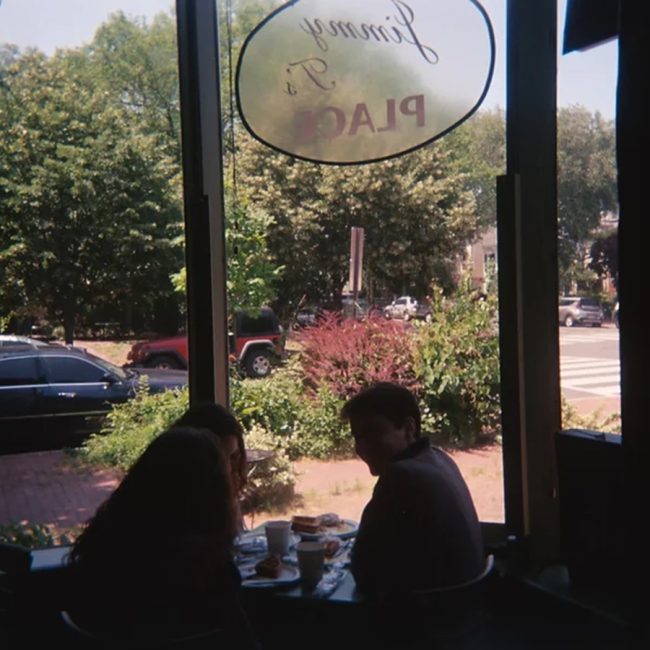 One Way Out band members sit inside Jimmy T's restaurant.