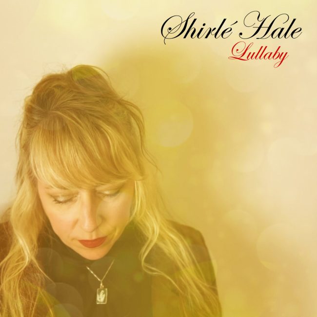 Shirlé Hale looking down on a bright, yellow background. In the top right corner is Shirlé Hale in black cursive, and a Lullaby right below that in red cursive lettering.